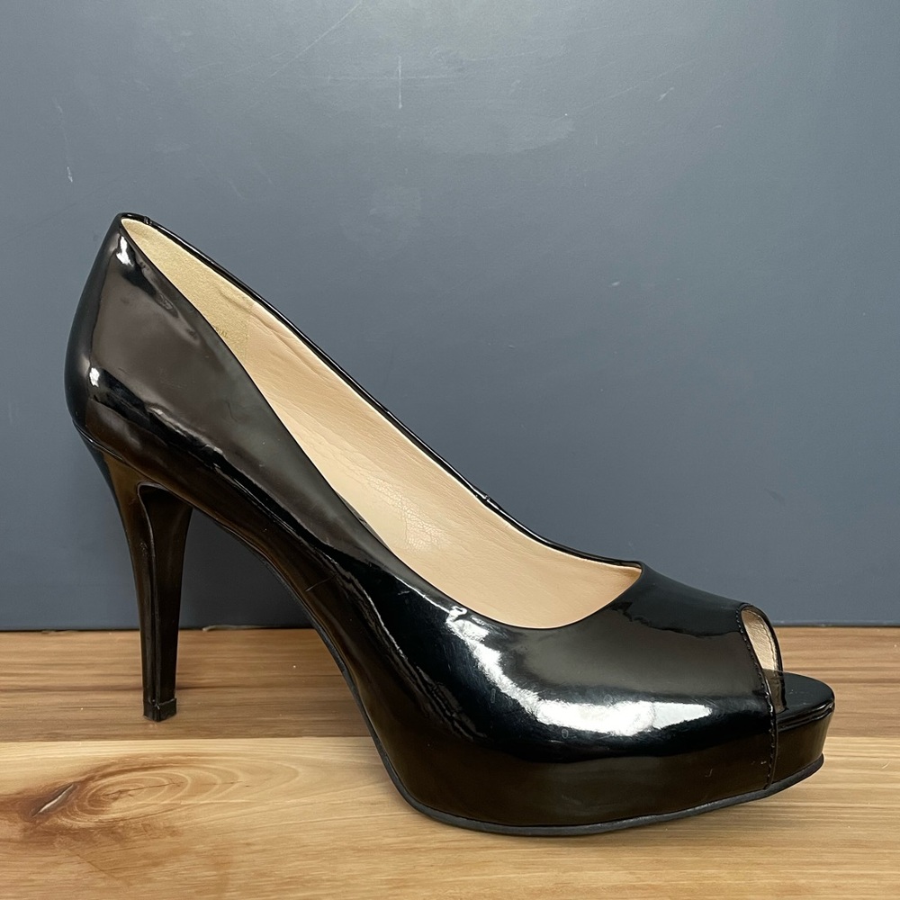 Nine West black patent leather platform pumps.  Size 8